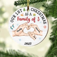 Das erste Weihnachtsfest des Babys als Familienkreis-Ornament